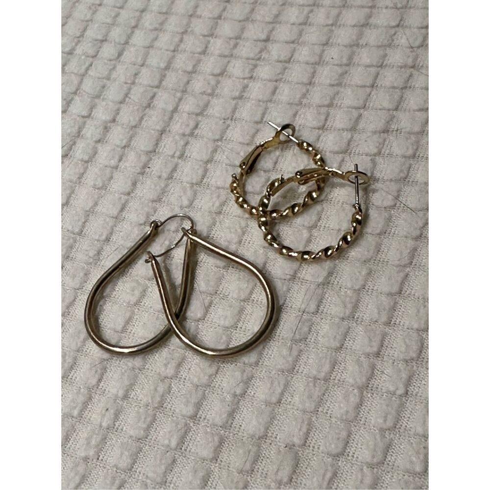 Two pairs of vintage gold tone hoops
